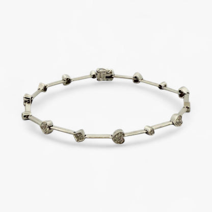 Comprar pulsera semirrígida realizada en oro blanco de 18kt con motivos de corazón, circulo y cuadrado y diamantes talla brillante. Joyas de segunda mano. 