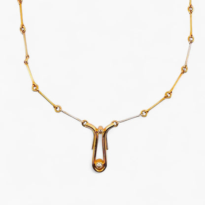 Comprar collar bicolor semirrígido realizado en oro blanco y amarillo de 18kt de 41,2cm de largo con diamantes talla brillante y cierre tipo gancho. Ian'Or.