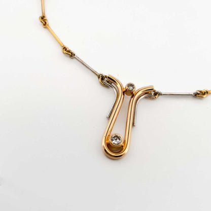 Comprar collar bicolor semirrígido realizado en oro blanco y amarillo de 18kt de 41,2cm de largo con diamantes talla brillante y cierre tipo gancho. Ian'Or.