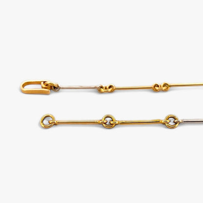Comprar collar bicolor semirrígido realizado en oro blanco y amarillo de 18kt de 41,2cm de largo con diamantes talla brillante y cierre tipo gancho. Ian'Or.