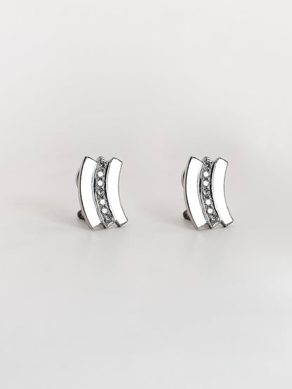 Comprar pendientes de oro blanco de 18kt con 7 diamantes talla brillante en cada pendiente. Cierre tipo omega. Joyas con diamantes baratas. Joyería Ian'Or.