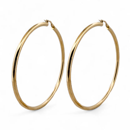 Comprar pendientes aro lisos en oro amarillo de 18kt de 66mm de diámetro y 3,03mm de grosor. Cierre tipo criolla. Joyería Ian'Or. Envío GRATIS. Ian'Or.

