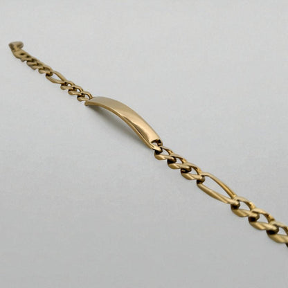 Pulsera no me olvides realizada oro amarillo de 18kt con cadena tipo cubana alterna 3x1 y una placa central. Pulseras de oro 18kt para hombre baratas
