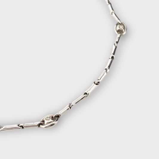 Collar de la firma italiana Chimento con cadena semirrígida oro blanco de 18kt con 14 diamantes talla brillante intercalados. Joyas de segunda mano alta gama. Joyería Compro Oro Barcelona. Joyas baratas.