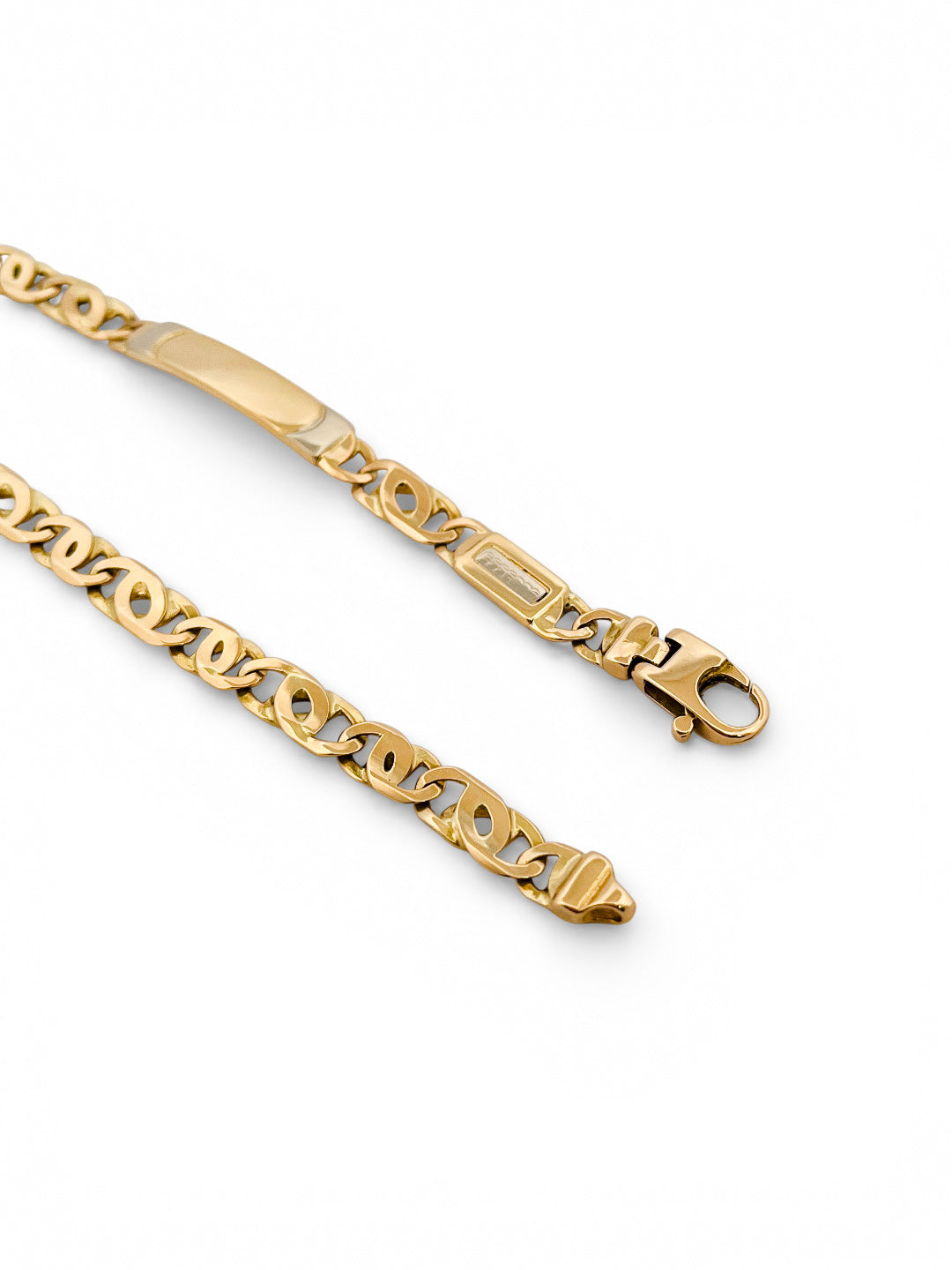 Comprar pulsera no me olvides realizada oro amarillo de 18kt con cadena tipo ojo de lince y una placa. Esta pulsera dispone de cierre tipo mosquetón.Esclavas de oro 18kt baratas.