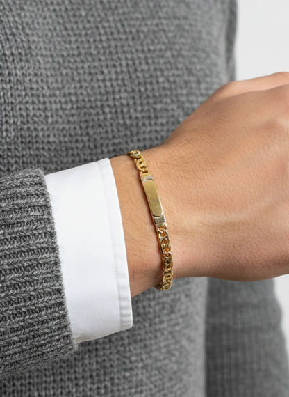 Comprar pulsera no me olvides realizada oro amarillo de 18kt con cadena tipo ojo de lince y una placa. Esta pulsera dispone de cierre tipo mosquetón.Esclavas de oro 18kt baratas.