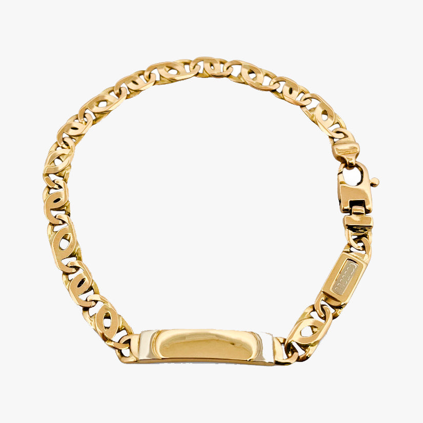Comprar pulsera no me olvides realizada oro amarillo de 18kt con cadena tipo ojo de lince y una placa. Esta pulsera dispone de cierre tipo mosquetón.Esclavas de oro 18kt baratas.