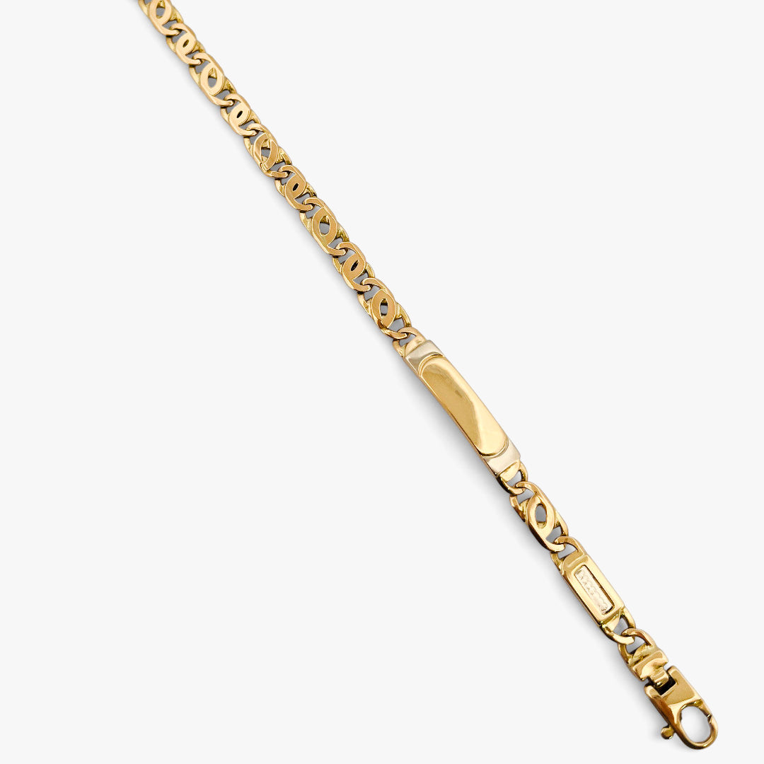 Comprar pulsera no me olvides realizada oro amarillo de 18kt con cadena tipo ojo de lince y una placa. Esta pulsera dispone de cierre tipo mosquetón.Esclavas de oro 18kt baratas.