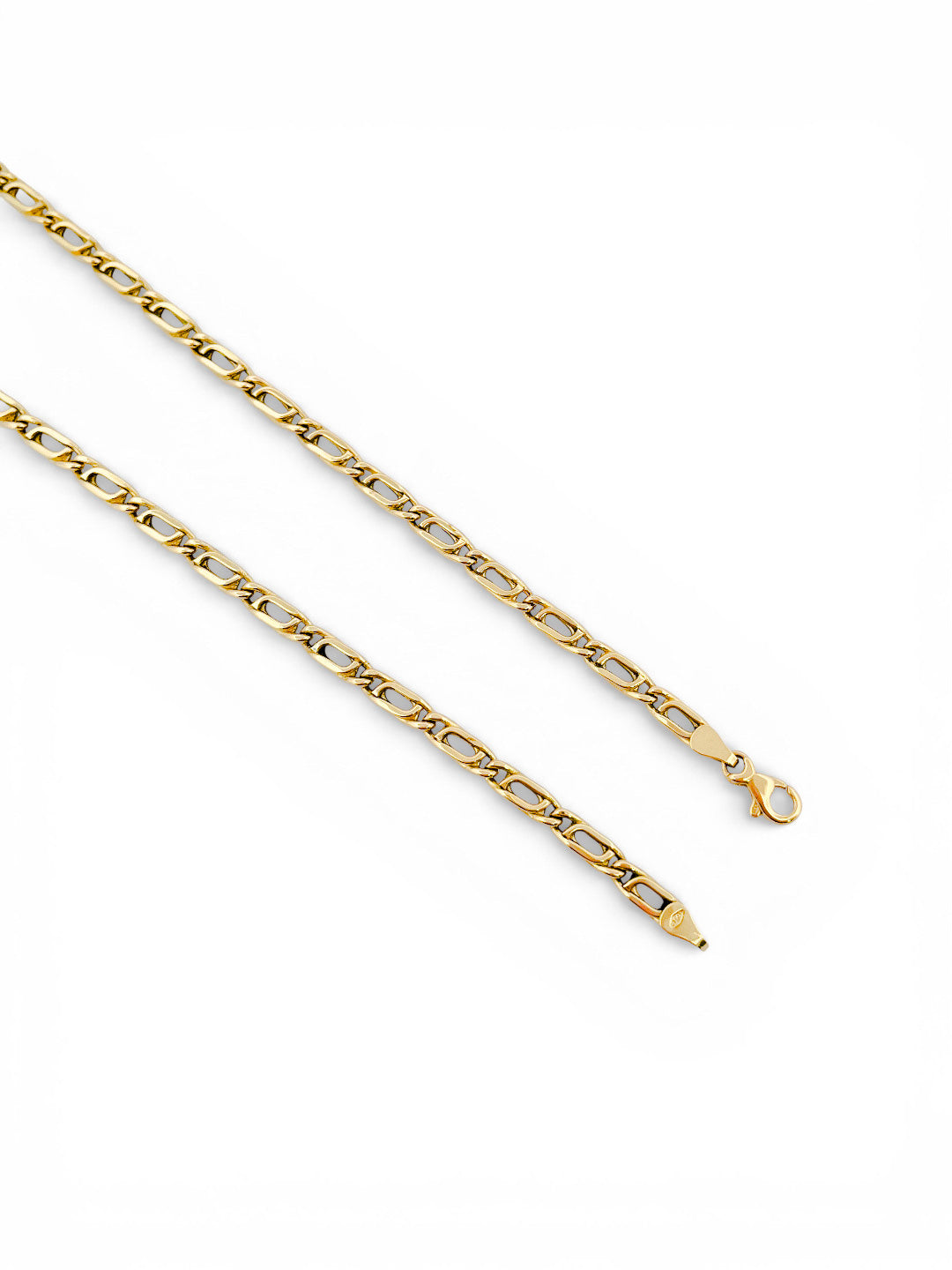 Comprar cadena realizada en oro amarillo de 18kt con eslabones ojo de tigre y cierre tipo mosquetón. Joyas restauradas. Cadenas de oro de 18kt