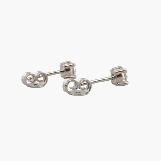 Comprar pendientes tipo dormilonas realizados en oro blanco de 18kt y brillantes con engaste en chatón.  Criollas de oro blanco y diamantes al mejor precio.
