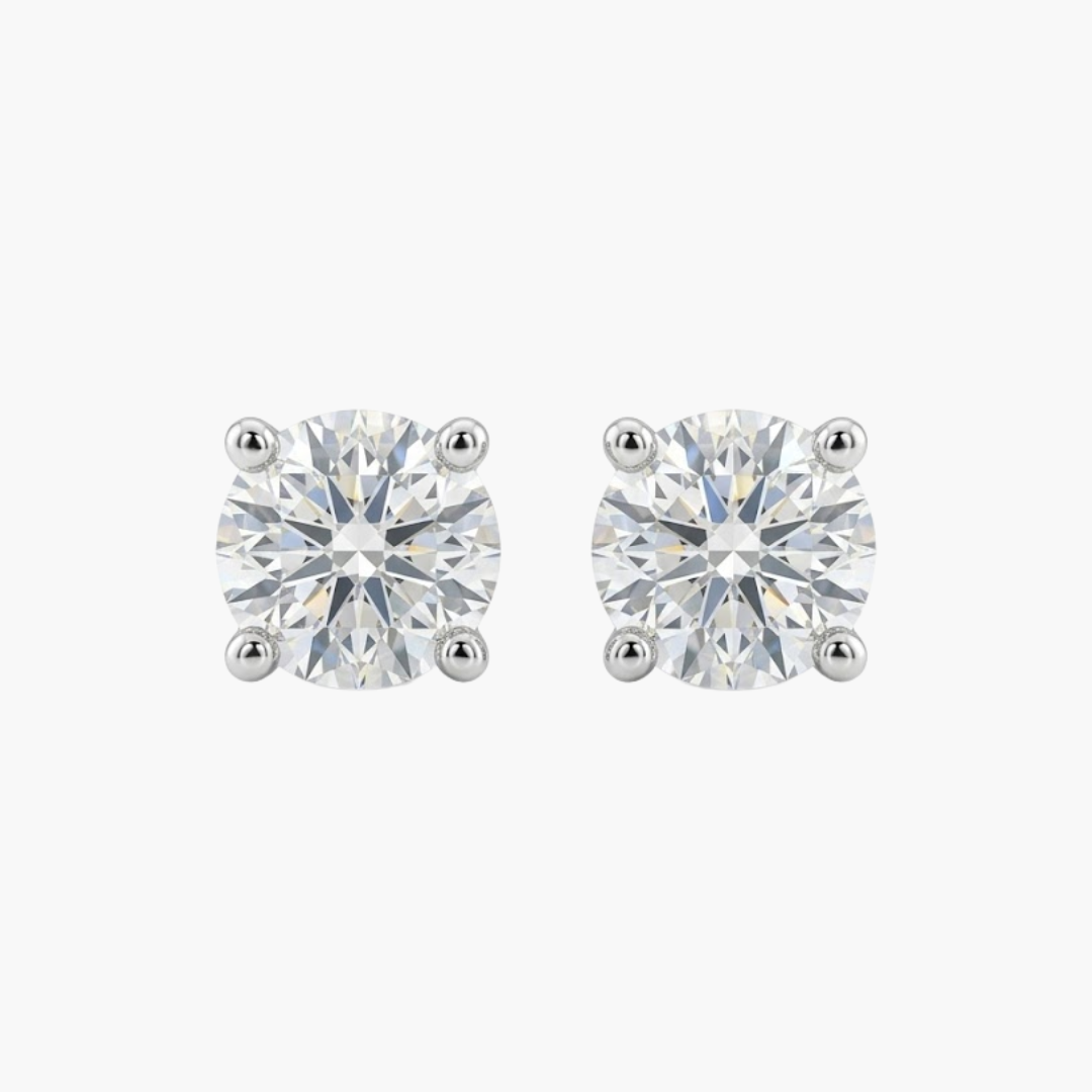 Comprar pendientes tipo dormilonas realizados en oro blanco de 18kt y brillantes con engaste en chatón.  Criollas de oro blanco y diamantes al mejor precio.
