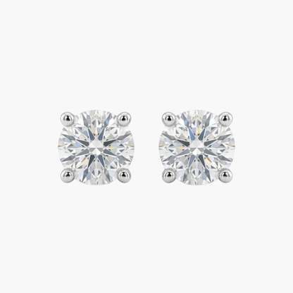 Comprar pendientes tipo dormilonas realizados en oro blanco de 18kt y brillantes con engaste en chatón.  Criollas de oro blanco y diamantes al mejor precio.

