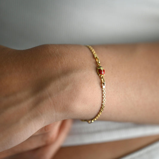 comprar Pulsera bismark de oro amarillo de 18Kt y cierre tipo mosquetón con tres mariquitas con esmalte rojo y negro. Envío gratuito