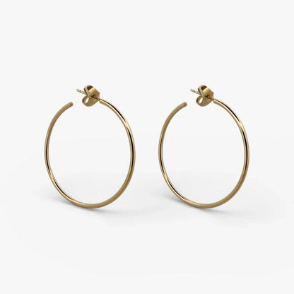 Comprar pendientes aro lisos en oro amarillo de 18kt de 40mm de diámetro y 1,66mm de grosor. Estos pendientes disponen de cierre presión. Envío GRATIS. Ian'Or.