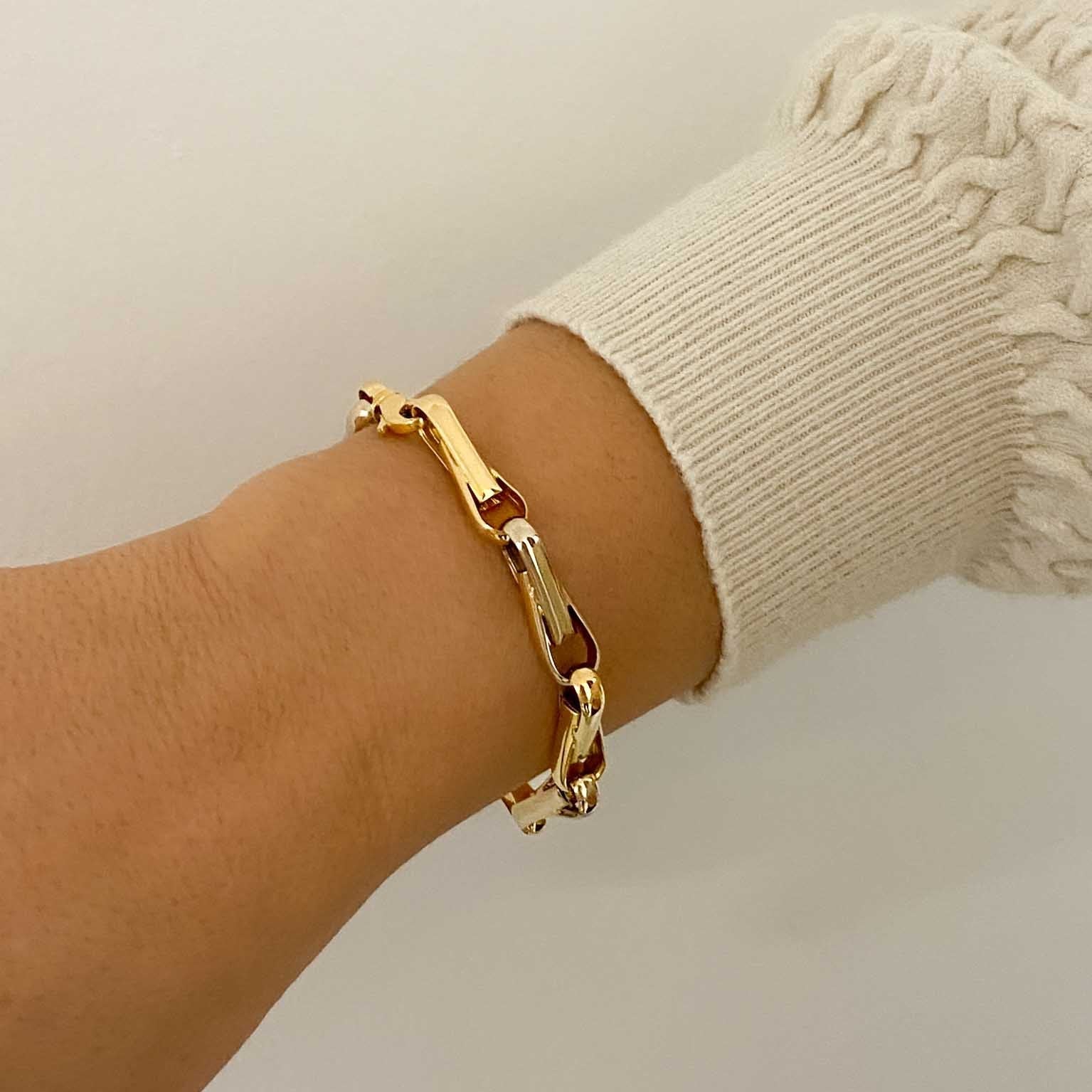 Pulsera de eslabones bicolor en oro blanco y amarillo de 18Kt de 19cm de largo y cierre tipo mosquetón. Pulseras de oro baratas Barcelona. Joyería Ian'Or.