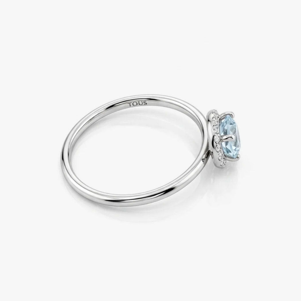 Comprar anillo en oro blanco de 18kt de la firma Tous con un Topacio central y rosetón de diamantes talla brillante alrededor. Joyas Tous baratas. Joyas restauradas.