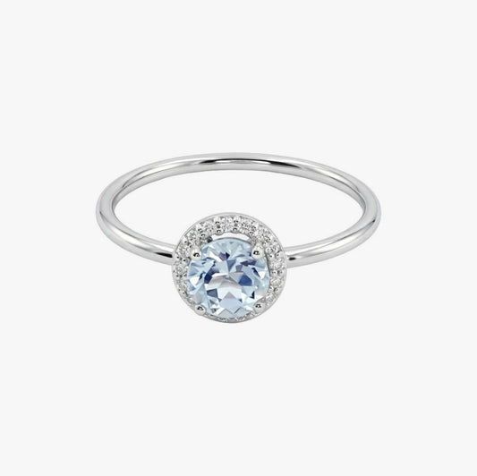 Comprar anillo en oro blanco de 18kt de la firma Tous con un Topacio central y rosetón de diamantes talla brillante alrededor. Joyas Tous baratas. Joyas restauradas.