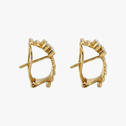 Comprar pendientes de oro amarillo de 18kt con 6 diamantes en cada pendiente. Estos preciosos pendientes disponen de cierre tipo omega. Envio gratis