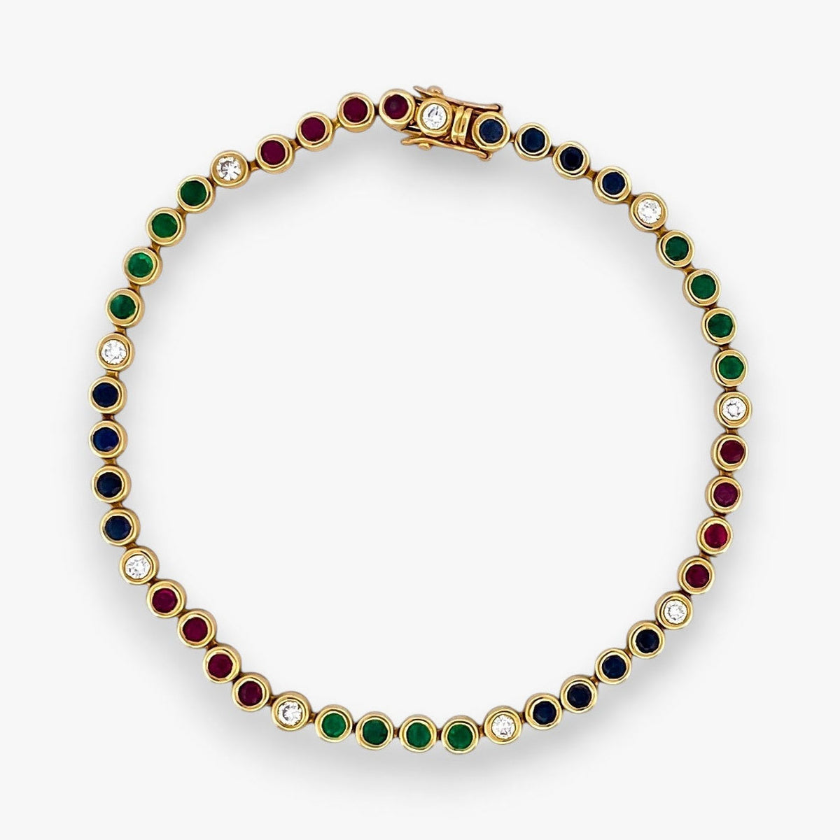 Pulsera semirígida de oro de 18kt con 3 rubíes, 3 esmeraldas y 30 zafiros azules talla princesa. Joyería Ian'Or. Joyas segunda vida. Envío GRATIS.