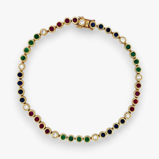 Pulsera semirígida de oro de 18kt con 3 rubíes, 3 esmeraldas y 30 zafiros azules talla princesa. Joyería Ian'Or. Joyas segunda vida. Envío GRATIS.