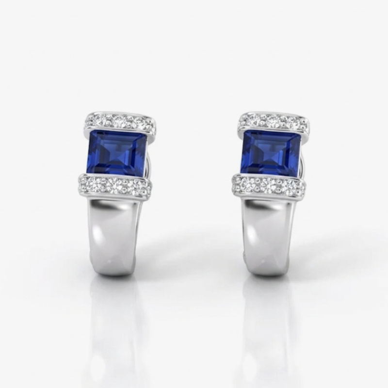 Pendientes realizados en oro blanco de 18kt con una amatista en cada pendiente talla baguette y carril de diamantes alrededor de la amatista. Ian'Or.
