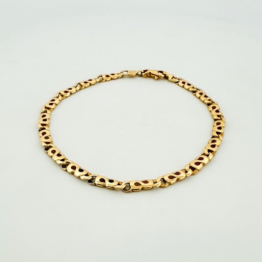 Pulsera oro amarillo de 18kt con eslabones en forma de infinito. Cierre tipo mosquetón.. Comprar pulseras de oro al mejor precio en Barcelona