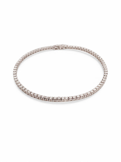 Pulsera en oro blanco Riviere de 18K con diamantes talla brillante y cierre seguro. Compra y venta de joyas en Barcelona de segunda mano restauradas al mejor precio.
