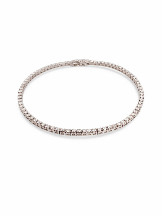 Pulsera en oro blanco Riviere de 18K con diamantes talla brillante y cierre seguro. Compra y venta de joyas en Barcelona de segunda mano restauradas al mejor precio.