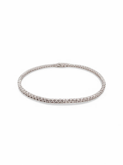 Pulsera en oro blanco Riviere de 18K con diamantes talla brillante y cierre seguro. Compra y venta de joyas en Barcelona de segunda mano restauradas al mejor precio.
