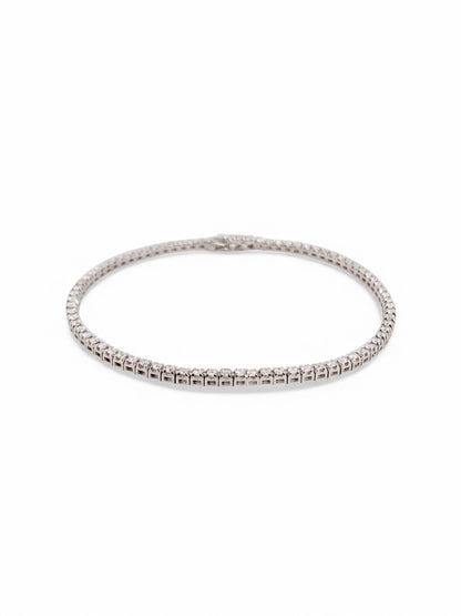 Pulsera en oro blanco Riviere de 18K con diamantes talla brillante y cierre seguro. Compra y venta de joyas en Barcelona de segunda mano restauradas al mejor precio.