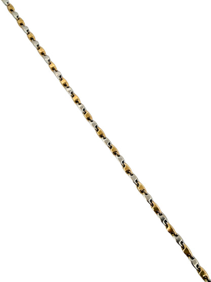 Cadena de oro blanco y amarillo alterno de 18kt con cadena diseño adige y cierre tipo mosquetón.