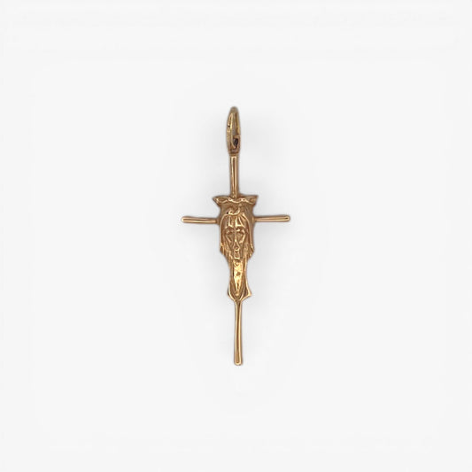 Comprar Colgante en forma de cruz con la cara de cristo en el centro realizada en oro amarillo de 18kt. Una preciosa cruz unisex.Cruces de oro 18kt baratas.