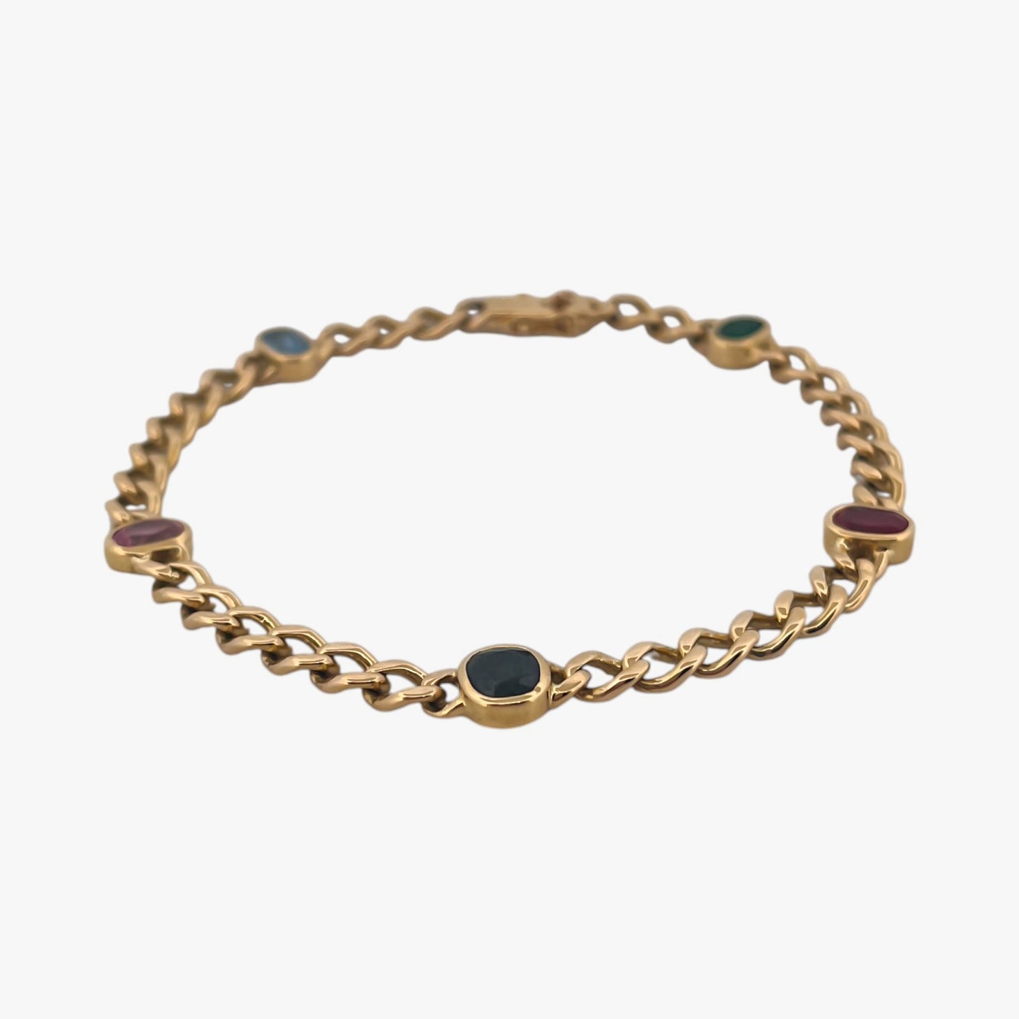 Comprar pulsera realizada oro amarillo de 18kt con cadena tipo barbada cubana y tiene 2 zafiros rosas, 1 zafiro azul y 1 topacio rosa, intercalados. Esta pulsera dispone de cierre tipo cajon con doble brazo de seguridad. Pulseras de oro 18kt baratas