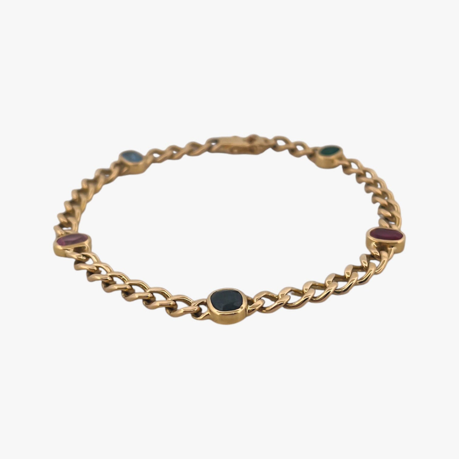 Comprar pulsera realizada oro amarillo de 18kt con cadena tipo barbada cubana y tiene 2 zafiros rosas, 1 zafiro azul y 1 topacio rosa, intercalados. Esta pulsera dispone de cierre tipo cajon con doble brazo de seguridad. Pulseras de oro 18kt baratas