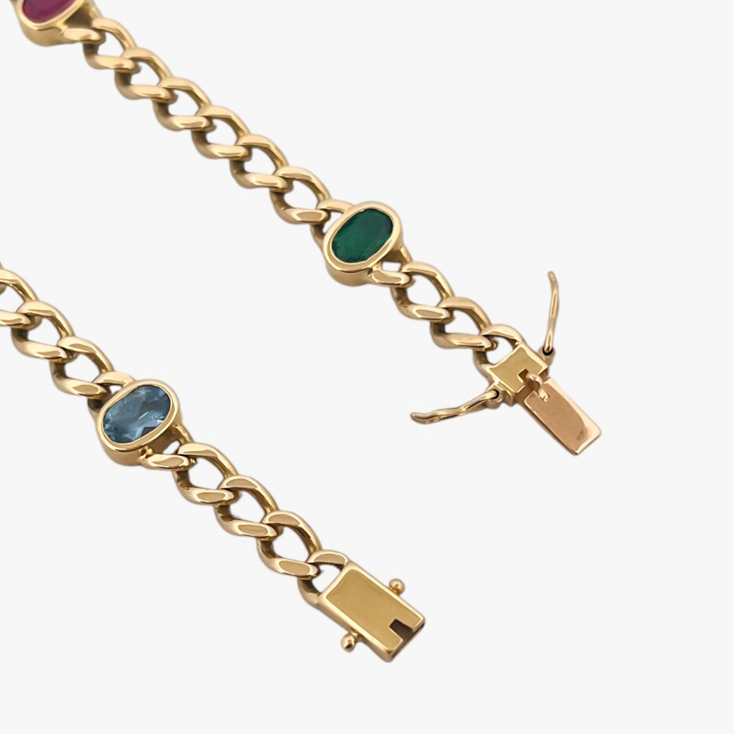 Comprar pulsera realizada oro amarillo de 18kt con cadena tipo barbada cubana y tiene 2 zafiros rosas, 1 zafiro azul y 1 topacio rosa, intercalados. Esta pulsera dispone de cierre tipo cajon con doble brazo de seguridad. Pulseras de oro 18kt baratas