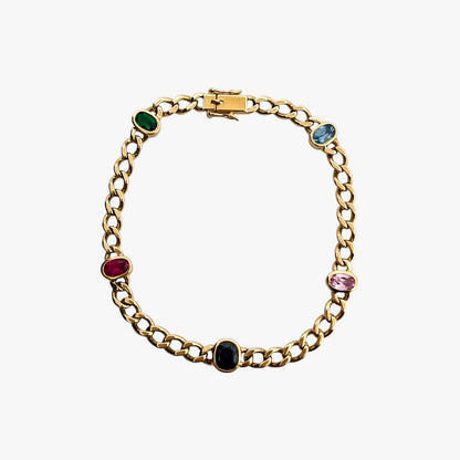 Comprar pulsera realizada oro amarillo de 18kt con cadena tipo barbada cubana y tiene 2 zafiros rosas, 1 zafiro azul y 1 topacio rosa, intercalados. Esta pulsera dispone de cierre tipo cajon con doble brazo de seguridad. Pulseras de oro 18kt baratas