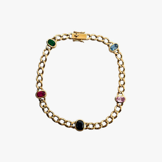 Comprar pulsera realizada oro amarillo de 18kt con cadena tipo barbada cubana y tiene 2 zafiros rosas, 1 zafiro azul y 1 topacio rosa, intercalados. Esta pulsera dispone de cierre tipo cajon con doble brazo de seguridad. Pulseras de oro 18kt baratas
