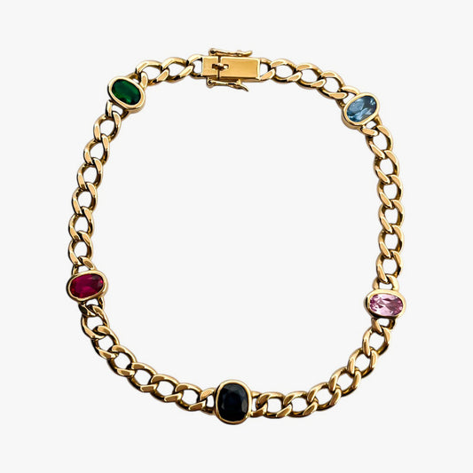 Comprar pulsera realizada oro amarillo de 18kt con cadena tipo barbada cubana y tiene 2 zafiros rosas, 1 zafiro azul y 1 topacio rosa, intercalados. Esta pulsera dispone de cierre tipo cajon con doble brazo de seguridad. Pulseras de oro 18kt baratas