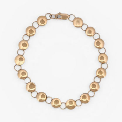 Comprar pulsera oro amarillo de 18kt con cadena de eslabones de bolitas planas. La pulsera mide 20,5cm y hace 7,77mm de grosor. Esta pulsera dispone de cierre tipo mosquetón.