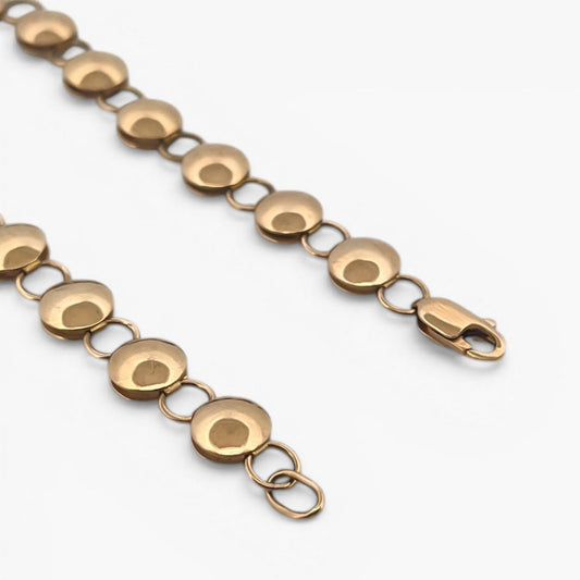Comprar pulsera oro amarillo de 18kt con cadena de eslabones de bolitas planas. La pulsera mide 20,5cm y hace 7,77mm de grosor. Esta pulsera dispone de cierre tipo mosquetón.