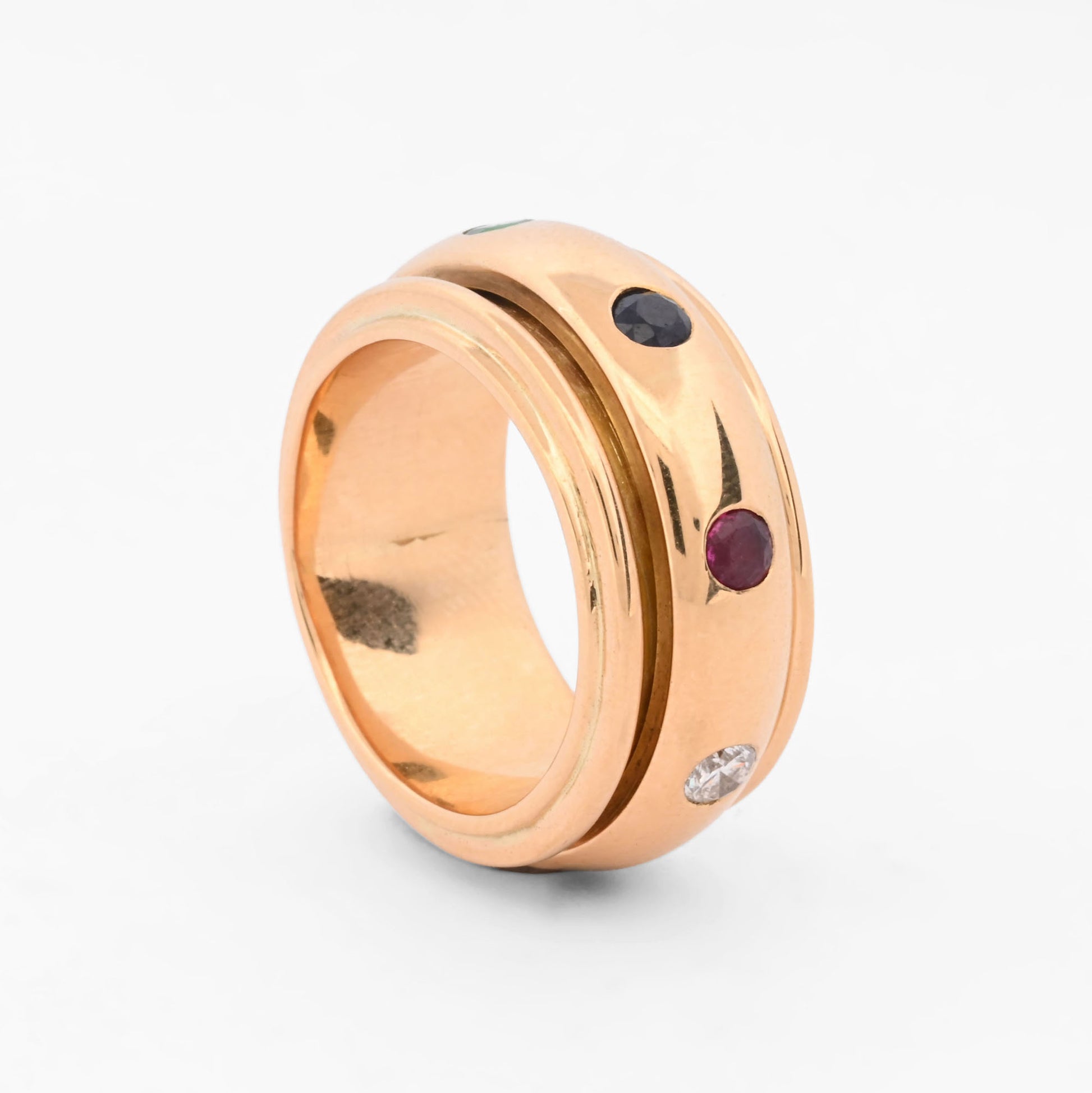 Anillo giratorio Piage de oro amarillo 18kt con piedras preciosas y diamantes. Pieza certificada y envío gratuito. Ian'or barcelona. Comprar joyas. Barcelona.
