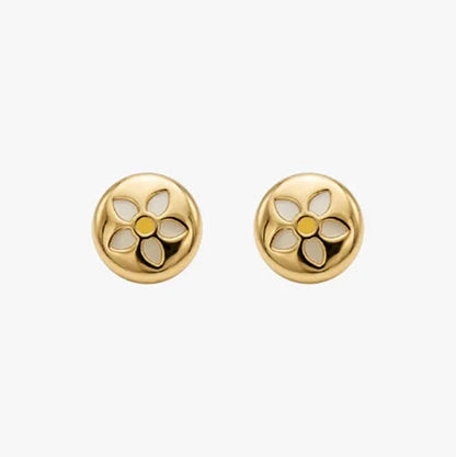 Comprar pendientes realizados en oro amarillo y en forma redonda con grabado de una margarita con fondo de nacar. Estos pendientes disponen de cierre a presión.
