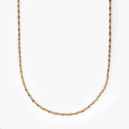 Comprar cadena Singapur de oro amarillo 18kt con eslabones trenzados de diseño retorcido y brillo único. Envío gratuito pieza certificada.