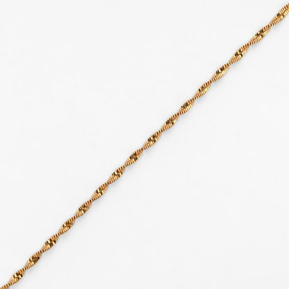 Comprar cadena Singapur de oro amarillo 18kt con eslabones trenzados de diseño retorcido y brillo único. Envío gratuito pieza certificada.
