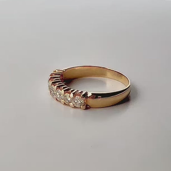 Comprar media alianza de oro amarillo de 18kt con 7 brillantes engastados en grapas. Joyas de segunda mano. Envío GRATIS. Anillos de compromiso baratos.
