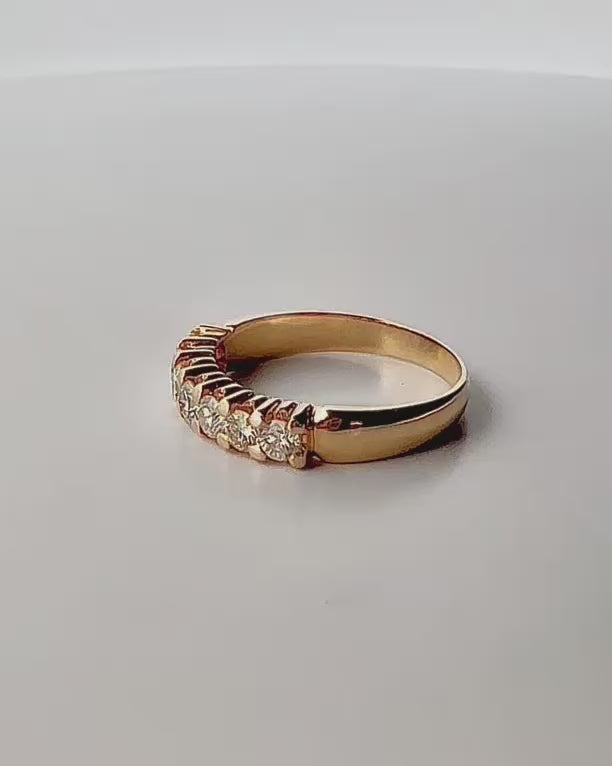 Comprar media alianza de oro amarillo de 18kt con 7 brillantes engastados en grapas. Joyas de segunda mano. Envío GRATIS. Anillos de compromiso baratos.
